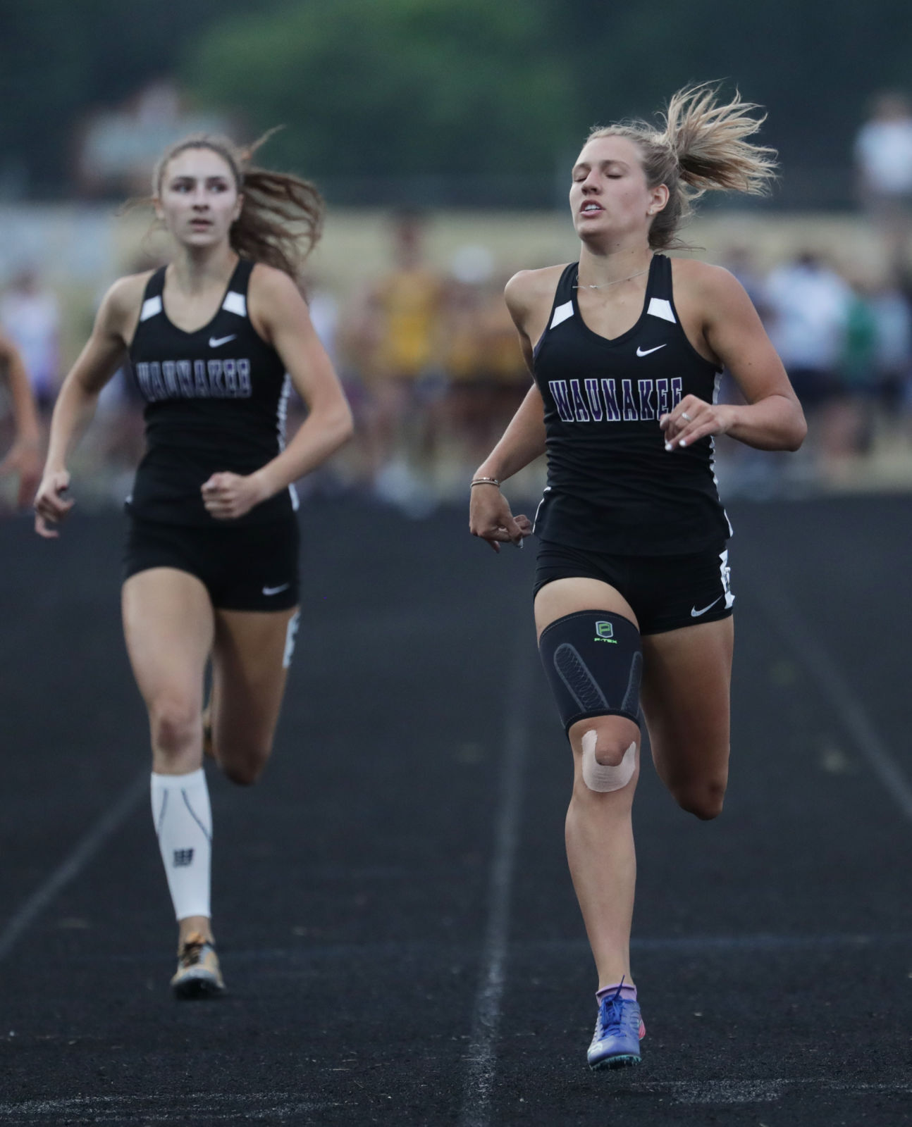 WIAA girls track photo: Waunakee's Chloe Larsen and Sarah Bova